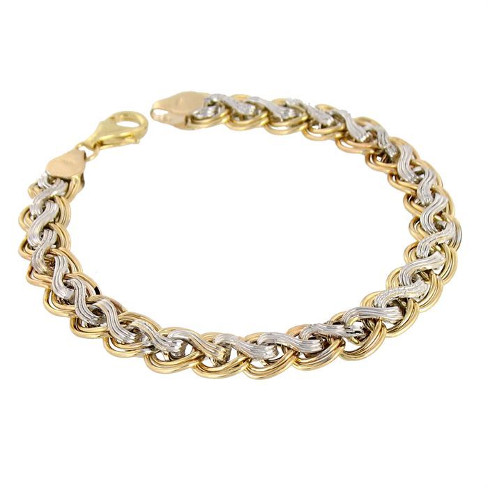 Bracelet en or jaune et blanc 375/1000 maille tresse. Poids moyen de l